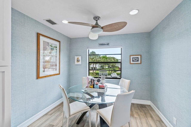 dining area featuring ceiling fan and light hardwood / wood-style flooring