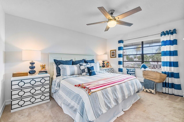 bedroom featuring light colored carpet and ceiling fan