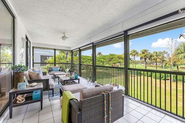 sunroom with ceiling fan and plenty of natural light