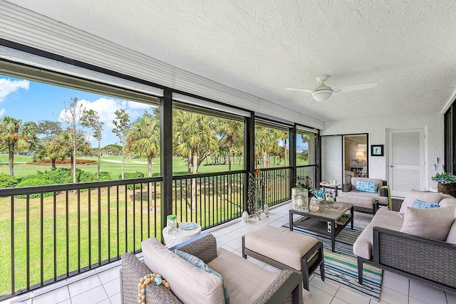 sunroom featuring ceiling fan