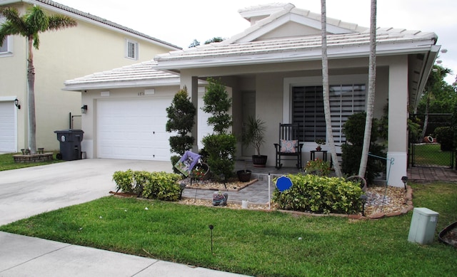 view of front facade featuring a garage and a front yard