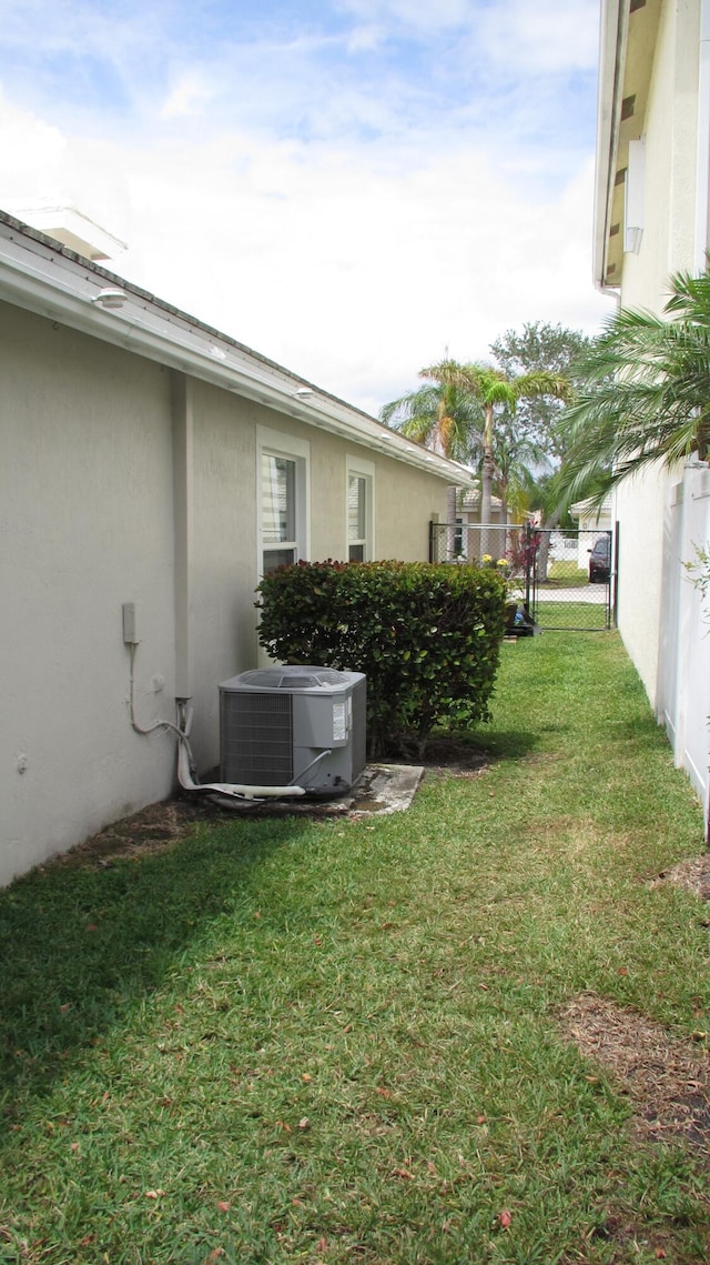 view of yard featuring central AC