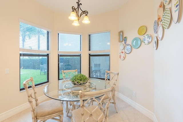 dining room featuring an inviting chandelier and plenty of natural light