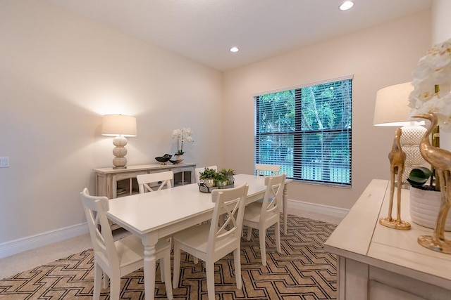 view of carpeted dining space