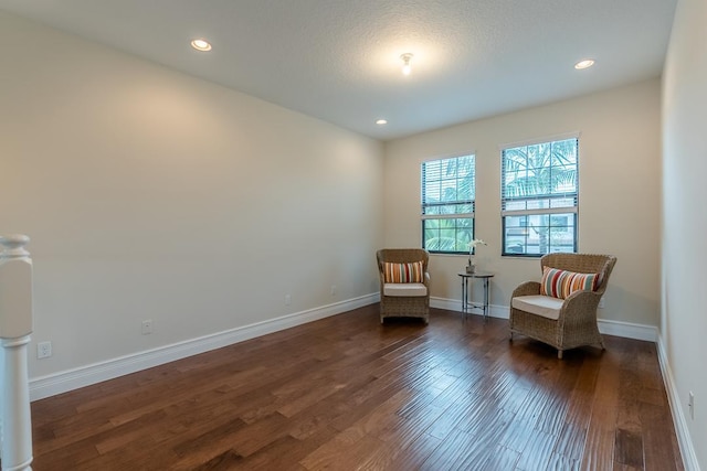 living area with dark wood-type flooring