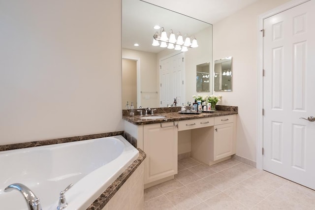 bathroom with vanity, tile patterned floors, and a relaxing tiled tub