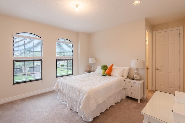 bedroom featuring light colored carpet