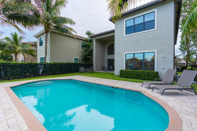 view of pool featuring a patio