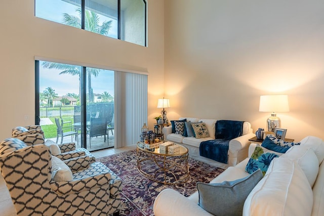 living room with a towering ceiling