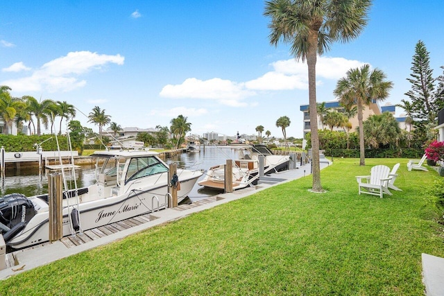 view of dock featuring a water view and a lawn