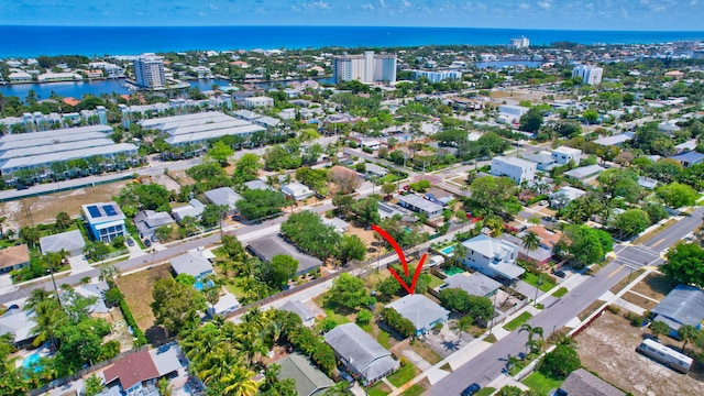 birds eye view of property with a water view