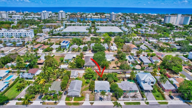 birds eye view of property featuring a water view