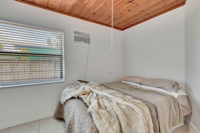 bedroom with a wall unit AC, tile flooring, and wooden ceiling