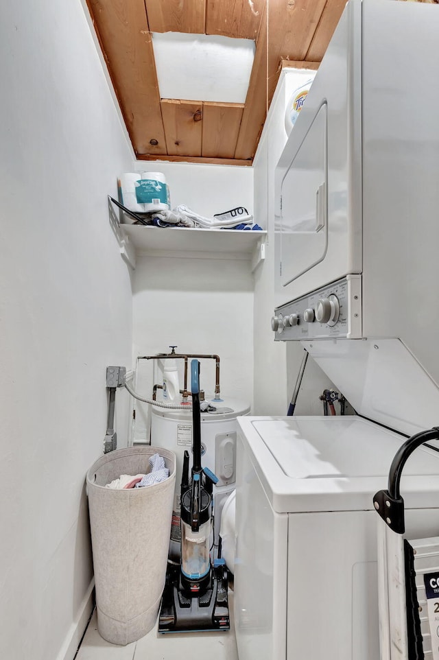 clothes washing area featuring wood ceiling and stacked washing maching and dryer