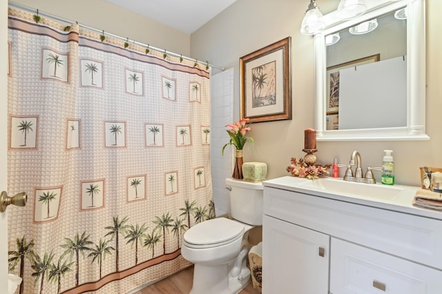 bathroom with hardwood / wood-style flooring, vanity, toilet, and a shower with shower curtain