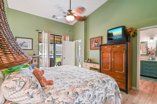 bedroom featuring lofted ceiling, ensuite bath, ceiling fan, access to exterior, and light hardwood / wood-style floors