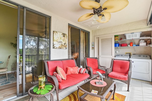 sunroom with washer and dryer and ceiling fan