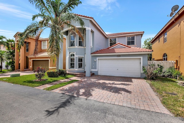 mediterranean / spanish house featuring a garage