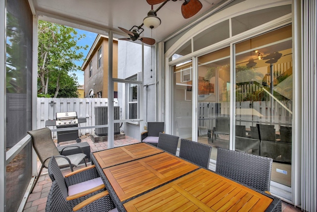 view of terrace with central AC, ceiling fan, and grilling area