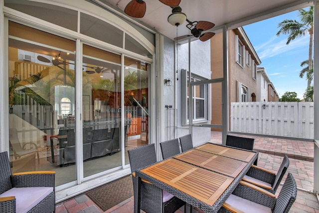 exterior space featuring ceiling fan