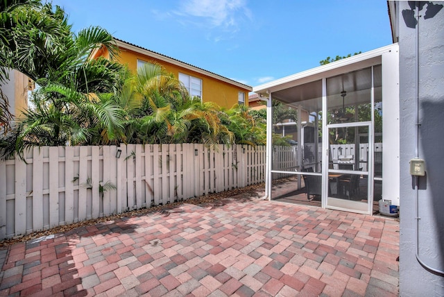 view of patio with a sunroom