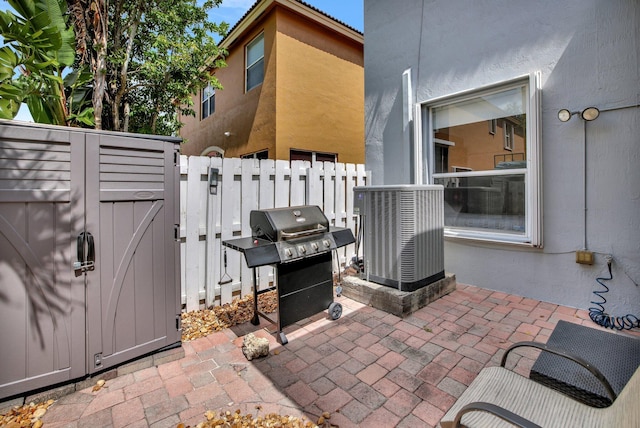 view of patio featuring a grill and central AC unit