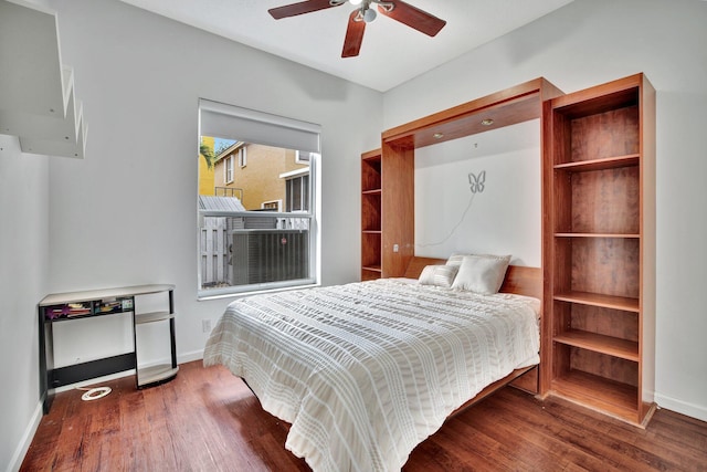 bedroom featuring dark hardwood / wood-style flooring and ceiling fan