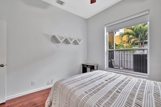 bedroom featuring ceiling fan and hardwood / wood-style floors