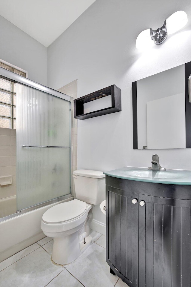 full bathroom with shower / bath combination with glass door, vanity, toilet, and tile flooring