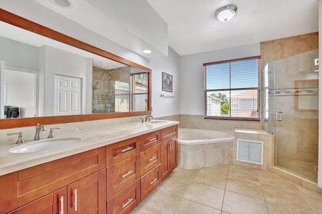 bathroom featuring tile flooring, oversized vanity, independent shower and bath, and dual sinks