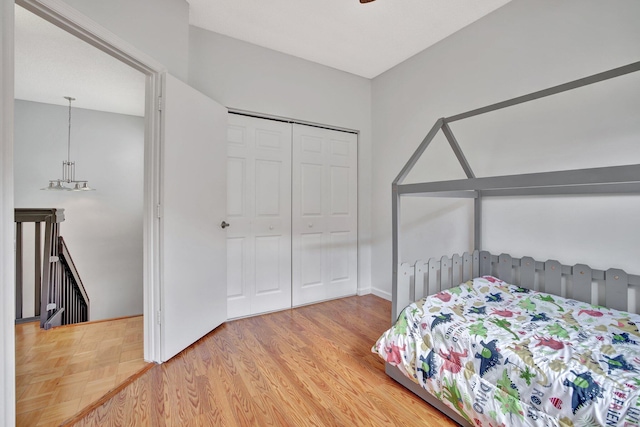 bedroom with a closet and hardwood / wood-style flooring