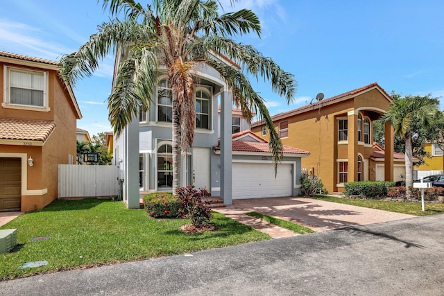 mediterranean / spanish home with a front yard