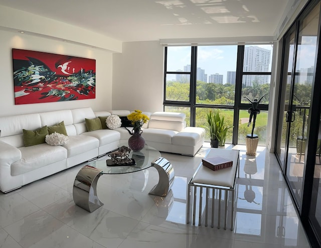 living room featuring floor to ceiling windows