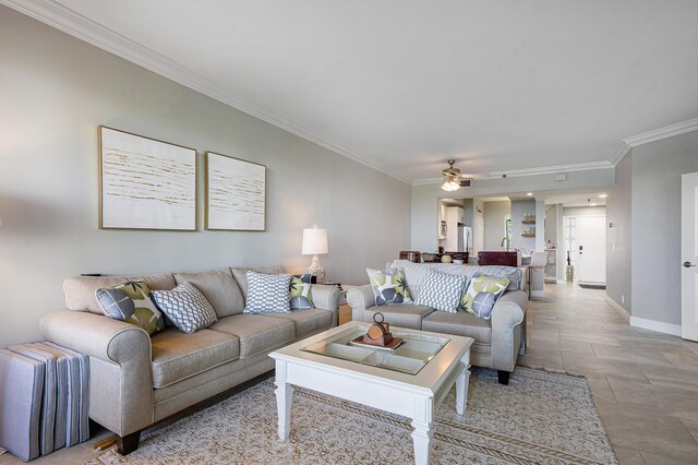 living room with ceiling fan and crown molding