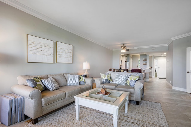 living room featuring ceiling fan and ornamental molding