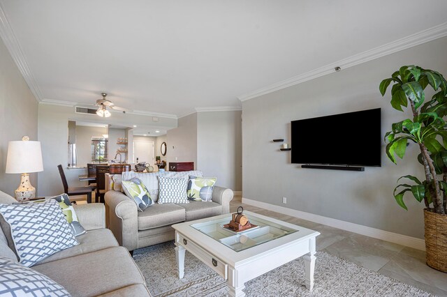 living room featuring ceiling fan and ornamental molding