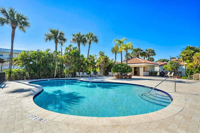 view of swimming pool featuring a patio