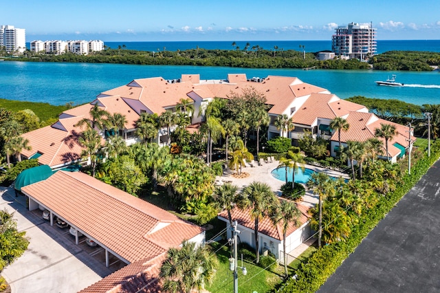 birds eye view of property with a water view