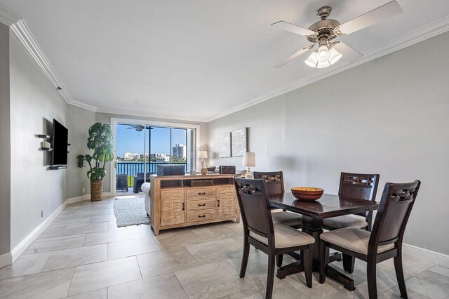 kitchen featuring decorative light fixtures, stainless steel appliances, white cabinetry, and light stone counters