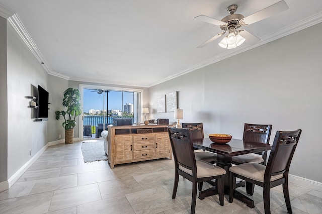 dining area featuring crown molding and ceiling fan