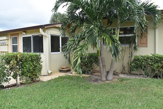 view of property exterior featuring a yard