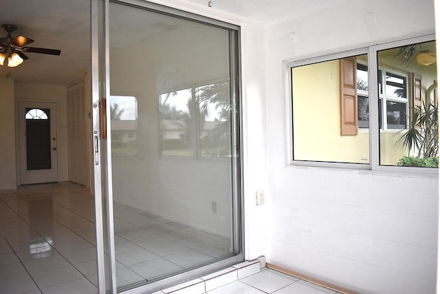 view of exterior entry with ceiling fan