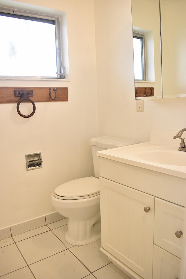 bathroom featuring vanity, toilet, and tile patterned flooring