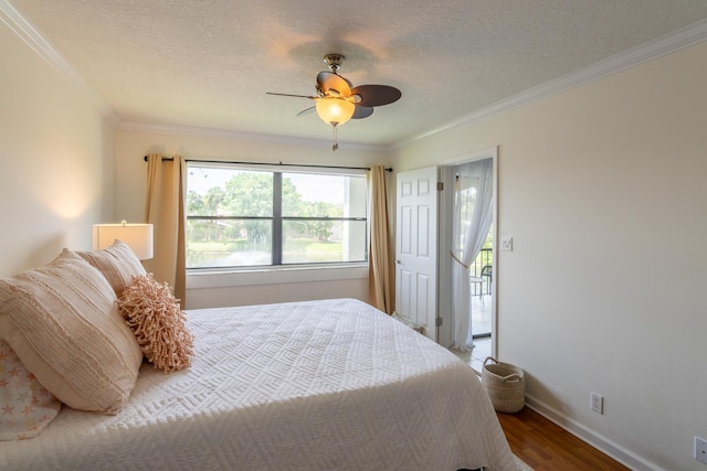 bedroom with ceiling fan, crown molding, hardwood / wood-style floors, and a textured ceiling