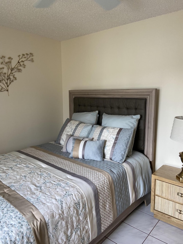 3560 Pine Tree Ct Unit A-2, Greenacres, FL 33463 - bedroom with light tile patterned floors and a textured ceiling