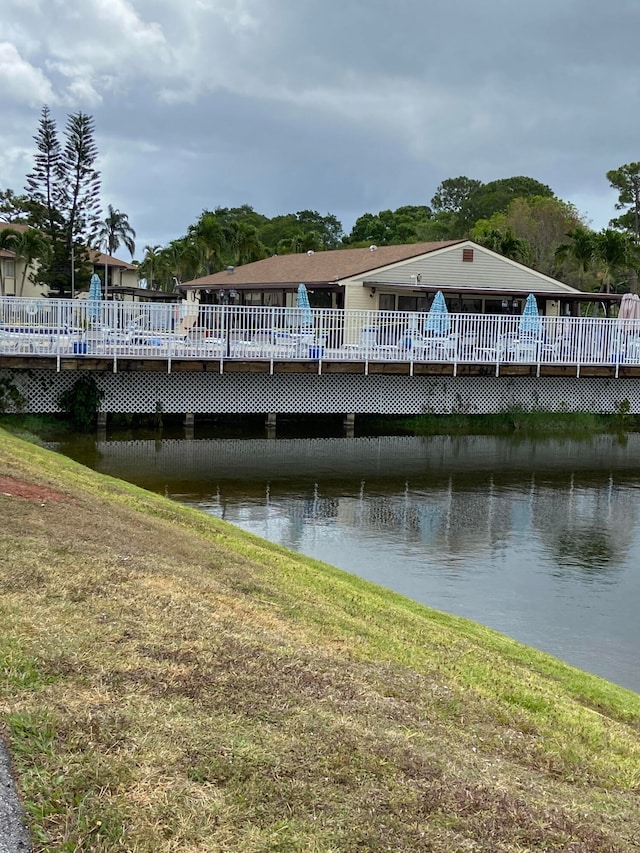 dock area with a deck with water view