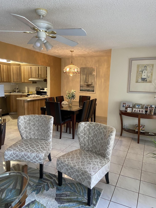 3560 Pine Tree Ct Unit A-2, Greenacres, FL 33463 - living room featuring a textured ceiling, a ceiling fan, and light tile patterned flooring