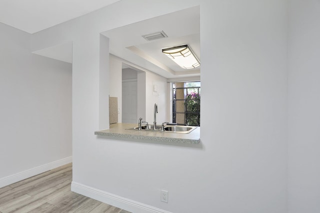 kitchen featuring sink and light hardwood / wood-style floors