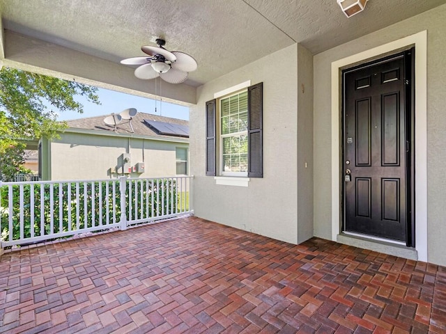 exterior space with ceiling fan