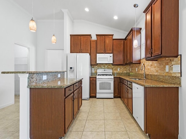 kitchen featuring decorative light fixtures, sink, white appliances, and tasteful backsplash